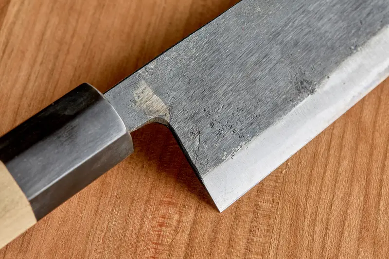 Close-up of a kurouchi (forge-black) finish on a Japanese gyuto